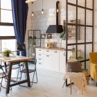 luxury modern design of a cozy small Scandinavian-style studio apartment with white walls, second floor with a library and huge high window