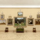 Exhibición. Se observa a una de las salas del museo de Filadelfia con obras de Rousseau, Courbet o Renoir.