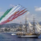 Genoa (Italy), 01/07/2023.- Planes release smoke in the colors of the Italian flag over the ship "Amerigo Vespucci" as it leaves from Genoa on world tour, Genoa, Italy, 01 July 2023. Italian naval academy flagship sailboat Amerigo Vespucci, one of the world"s most iconic "tall ships", is to take Italian products in "Made in Italy" global tour for 20 months visiting 28 countries and 31 ports. (Italia, Génova) EFE/EPA/MASSIMO PERCOSSI