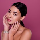 Portrait of stunning chic lady prepare for festive occasion skin care face peeling isolated on pink color background