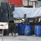 Nablus (-), 31/12/2023.- Israeli soldiers detain a Palestinian man during an Israeli army raid on the Askar refugee camp, on the outskirts of the West Bank city of Nablus, 31 December 2023. According to the Palestinian Health Ministry, at least five Palestinians were wounded and two arrested during the Israeli military raid and ensuing clashes at the Askar refugee camp. EFE/EPA/ALAA BADARNEH