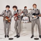 Los Beatles en acción.