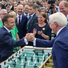 Berlin (Germany), 26/05/2024.- German President Frank-Walter Steinmeier and French President Emmanuel Macron (L) play table football as attend the Democracy festival, as part of the "75 years of the Basic Law" celebrations in Berlin, Germany, 26 May 2024. Macron visit Germany from 26 to 28 May. The French President and Federal President Steinmeier will visit several regions of Germany together. It is the first state visit - the highest form of visit in diplomatic protocol - by a French president to Germany in 24 years. (Francia, Alemania) EFE/EPA/HANNIBAL HANSCHKE