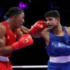 José Rodríguez (i) en su primer combate en unos Juegos Olímpicos