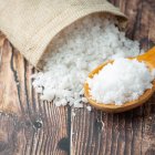 salt in wooden spoon place on floor