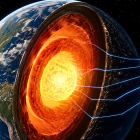 Una representación del interior de la Tierra muestra ondas sísmicas atravesando el manto y llegando hacia el núcleo, una técnica que permitió identificar posibles estructuras ocultas a gran profundidad.