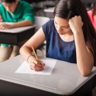 Group of high school students taking a test in a classroom
